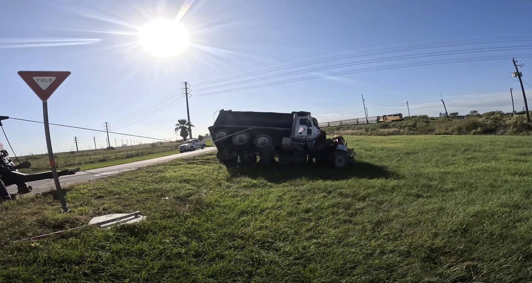Roadside scene showing proper safety positioning while waiting for tow truck