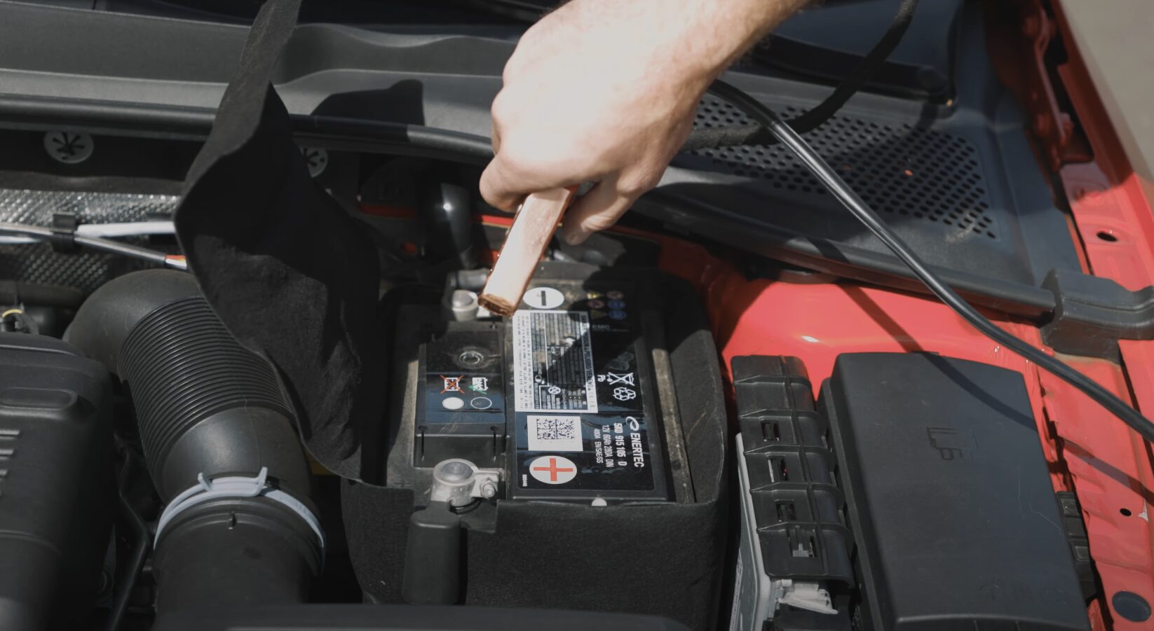 Professional technician providing roadside assistance and battery service