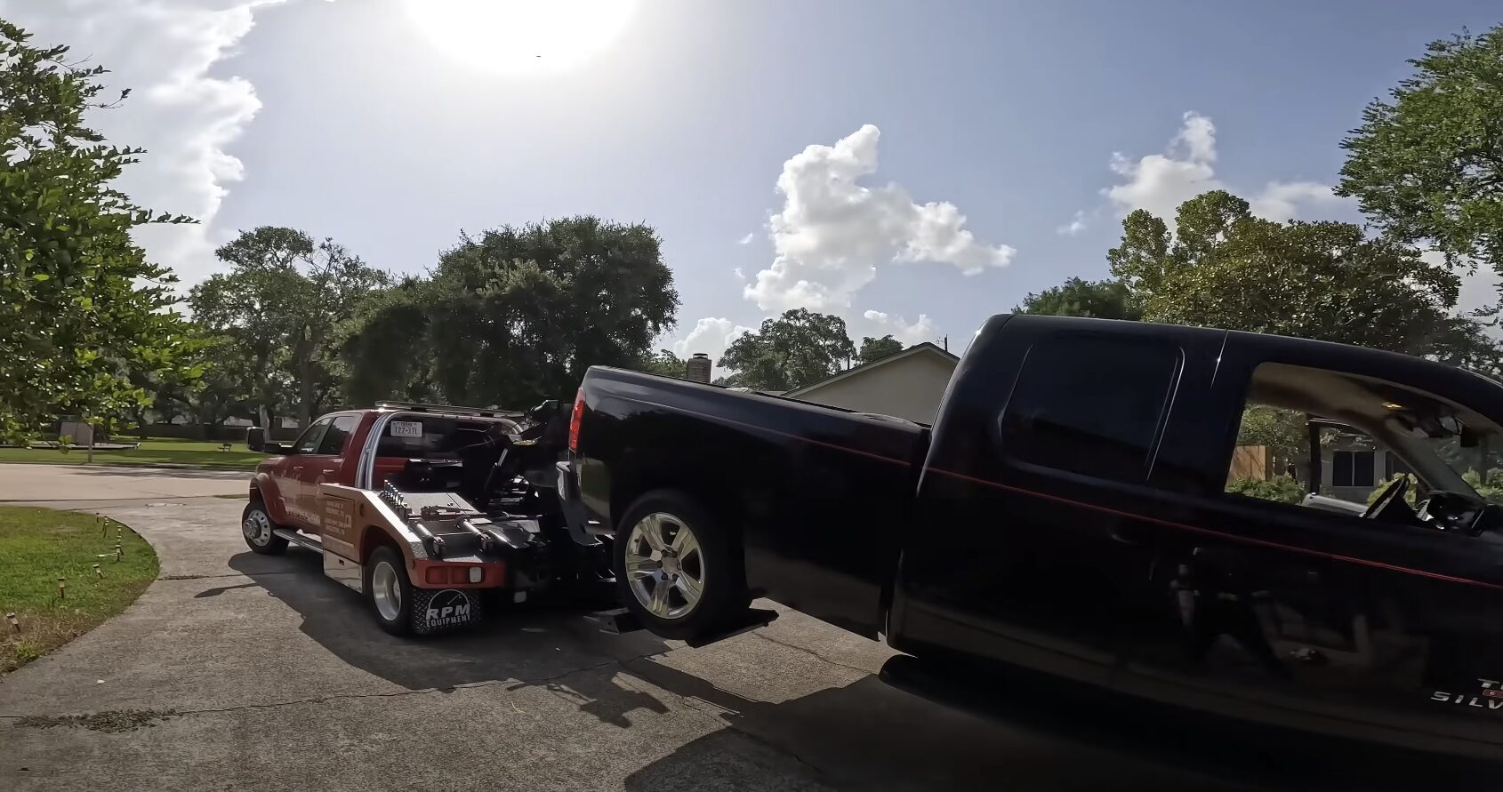 Professional towing and recovery operation on rural roadway